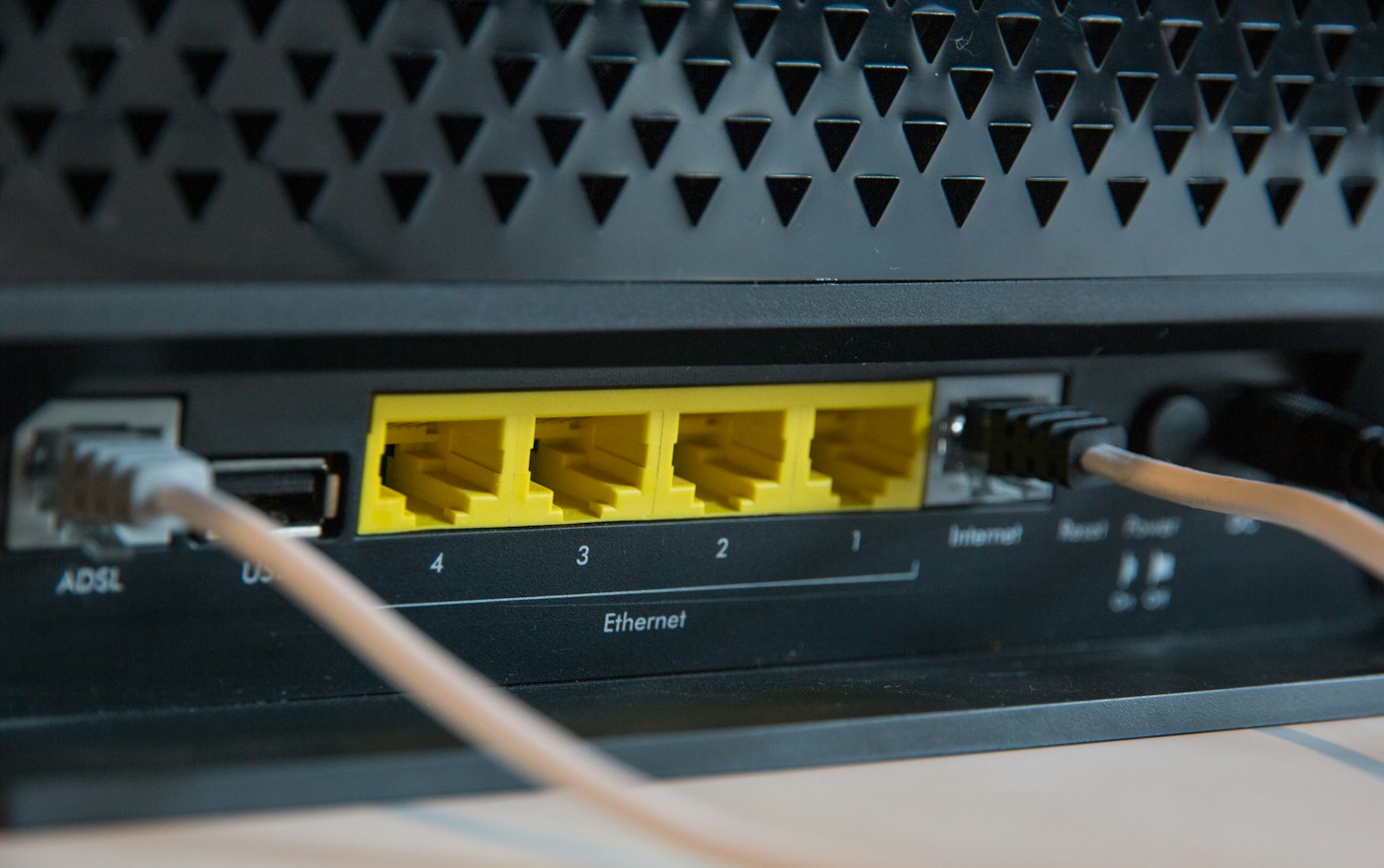 Power and network connections on the back of a router