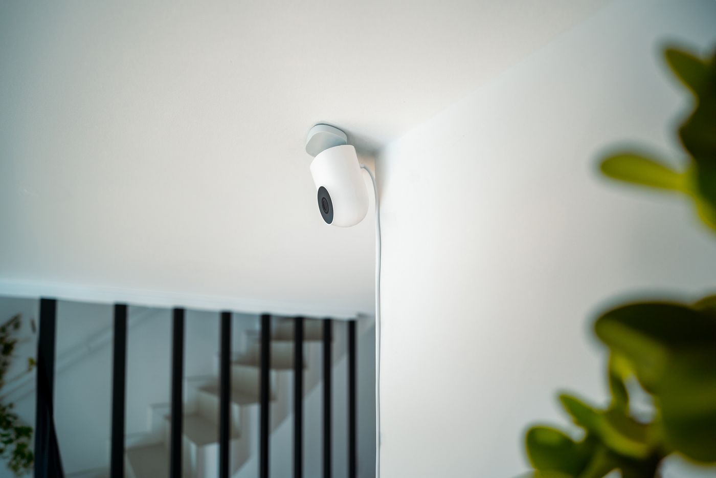 An indoor security camera mounted near a doorway