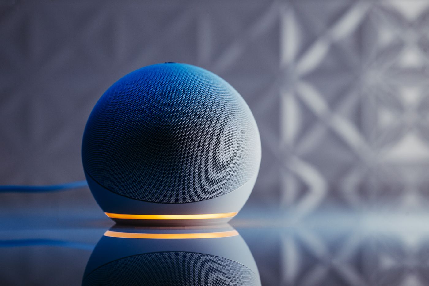 A smart speaker with an illuminated status ring