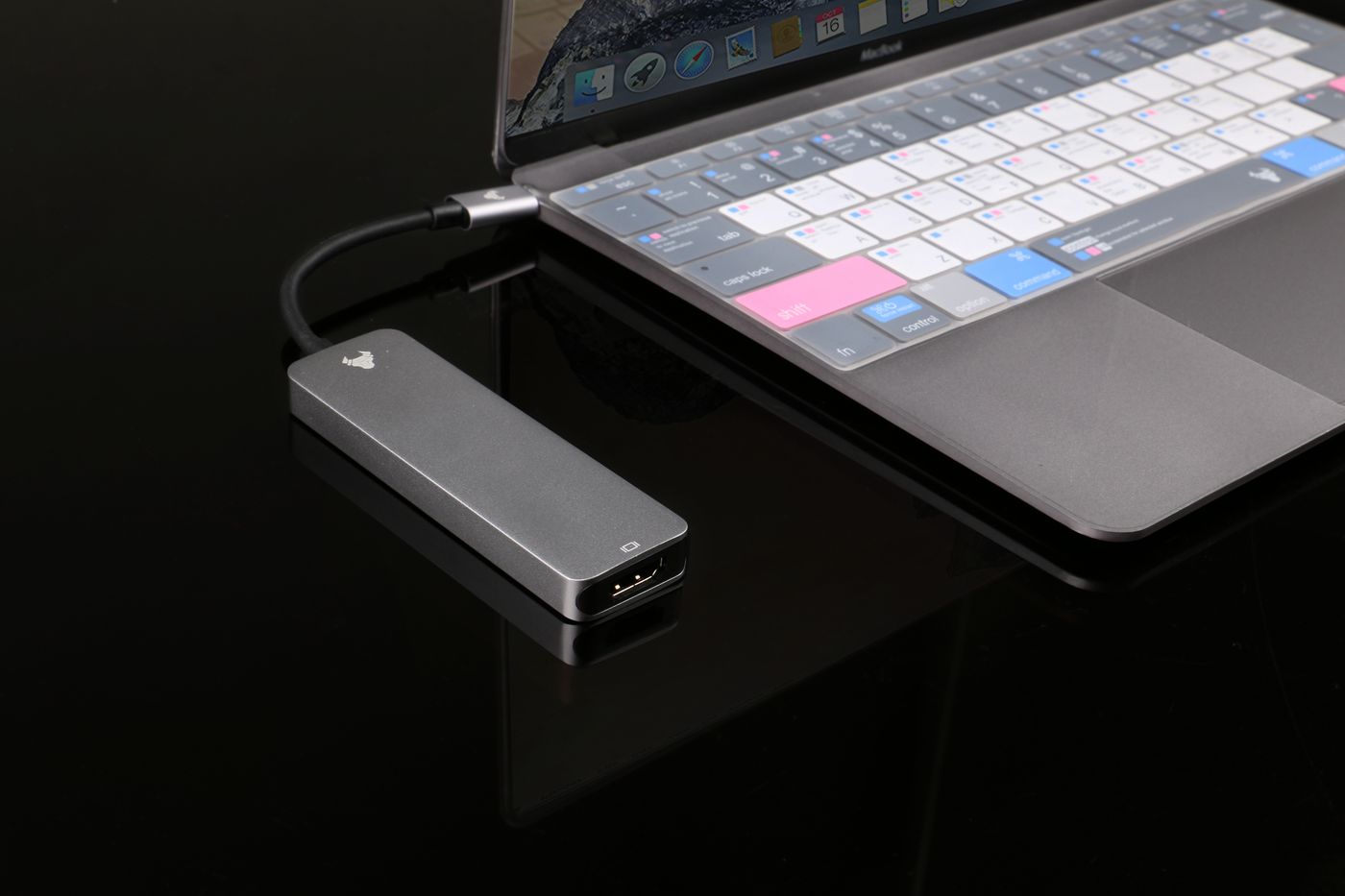 A multi-port USB adapter connected to a laptop