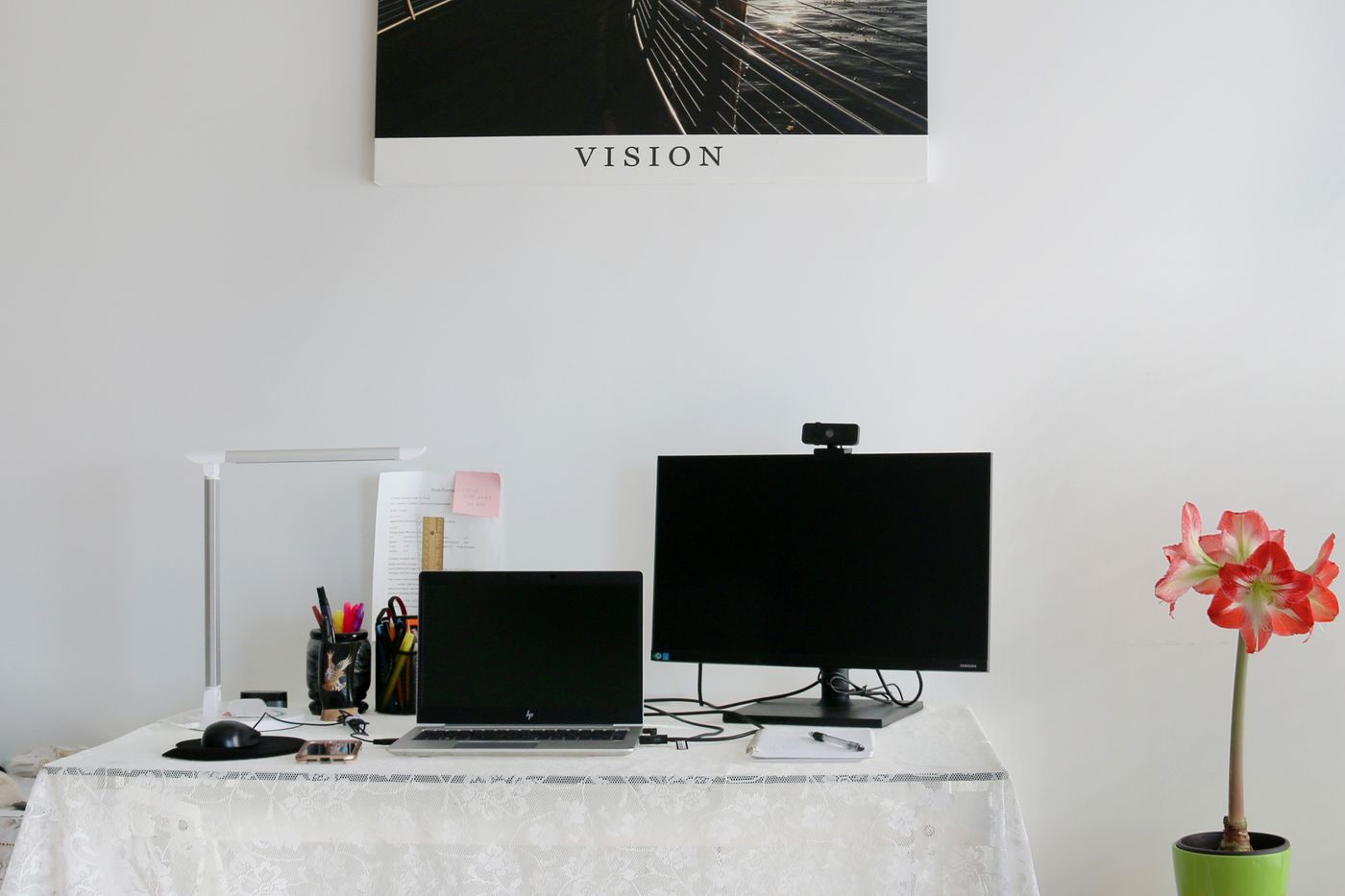 A webcam attached above a monitor in a bright room