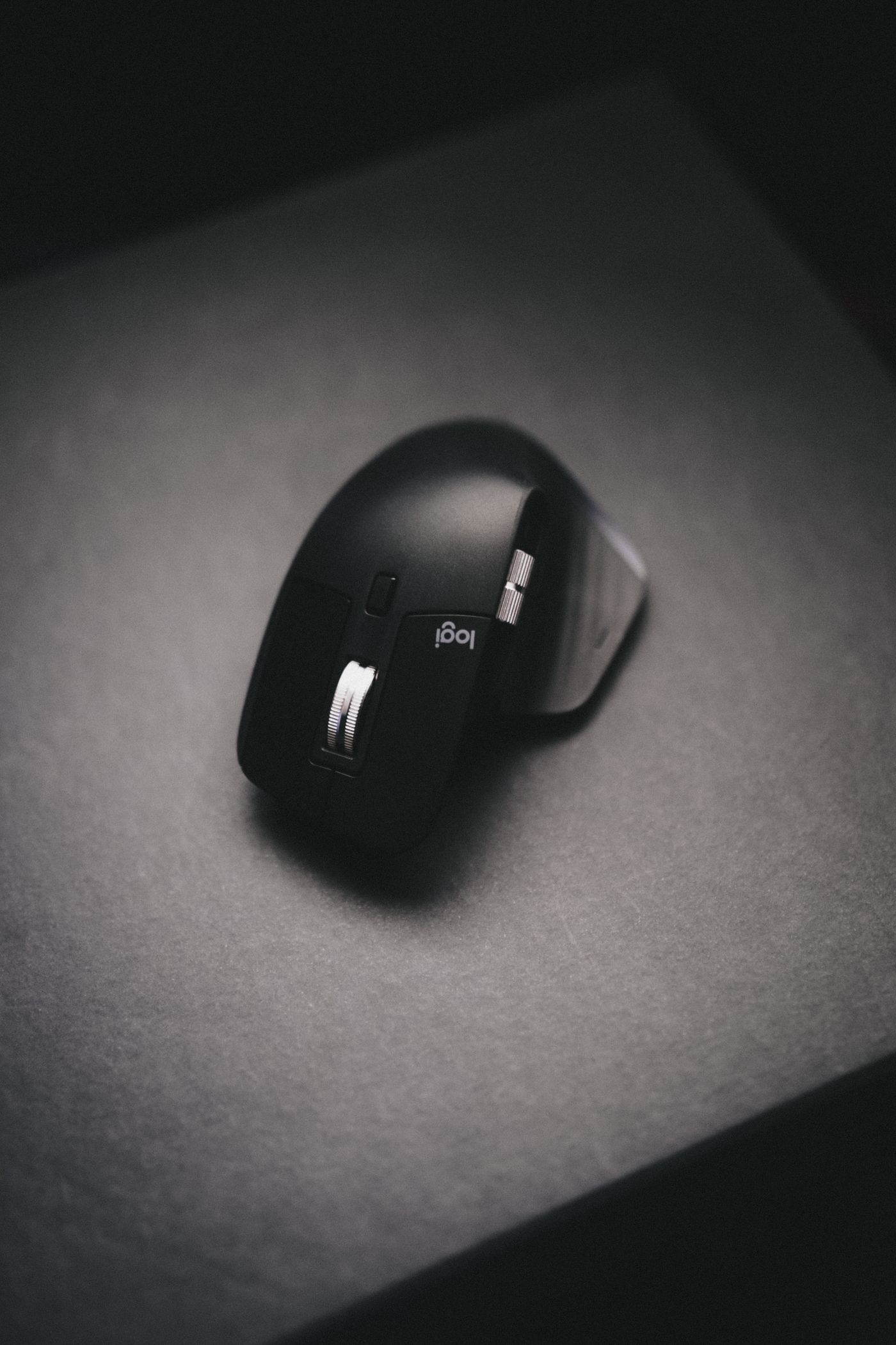 A wireless mouse with its buttons and scroll wheel