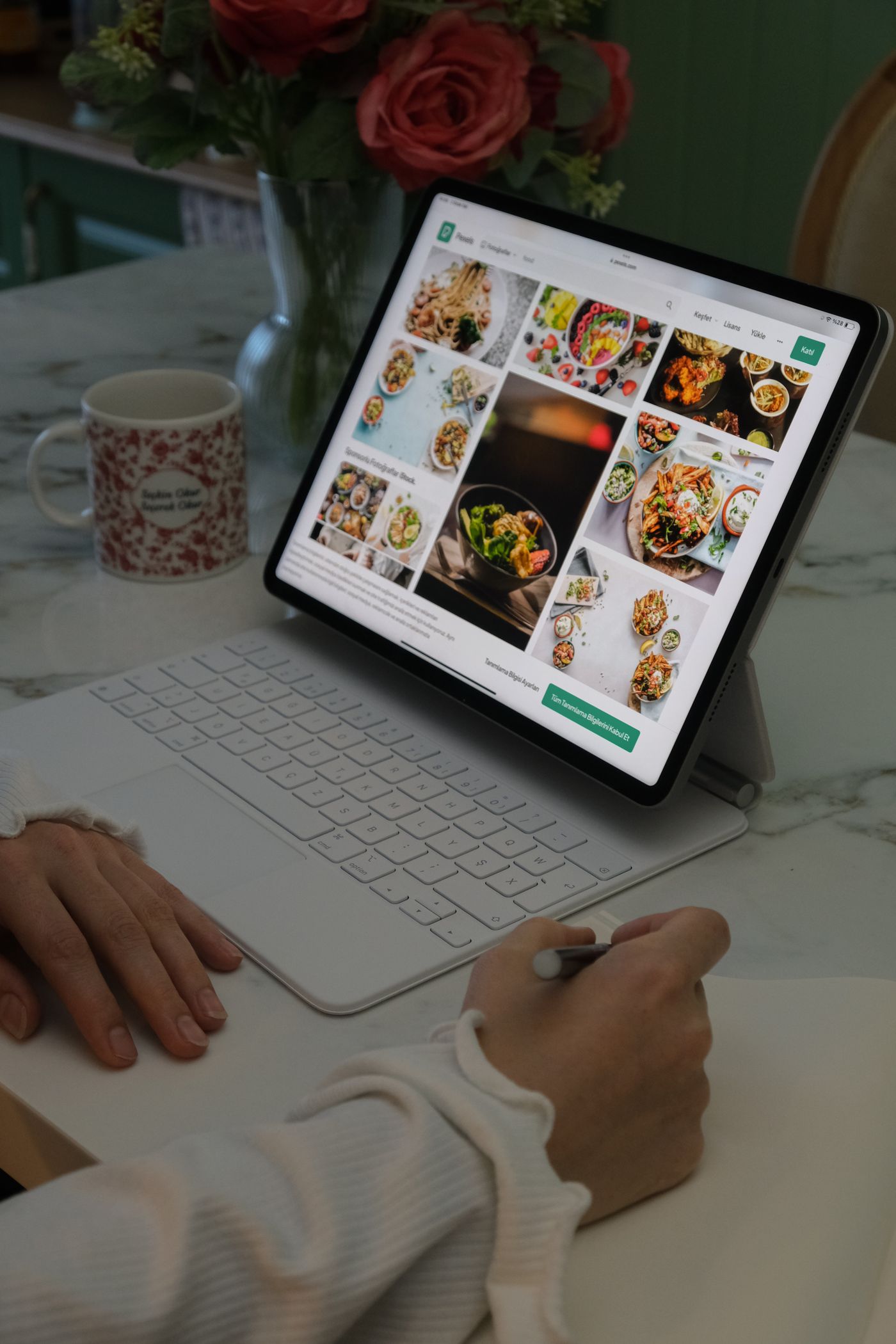 Tablet displaying food images on a kitchen counter