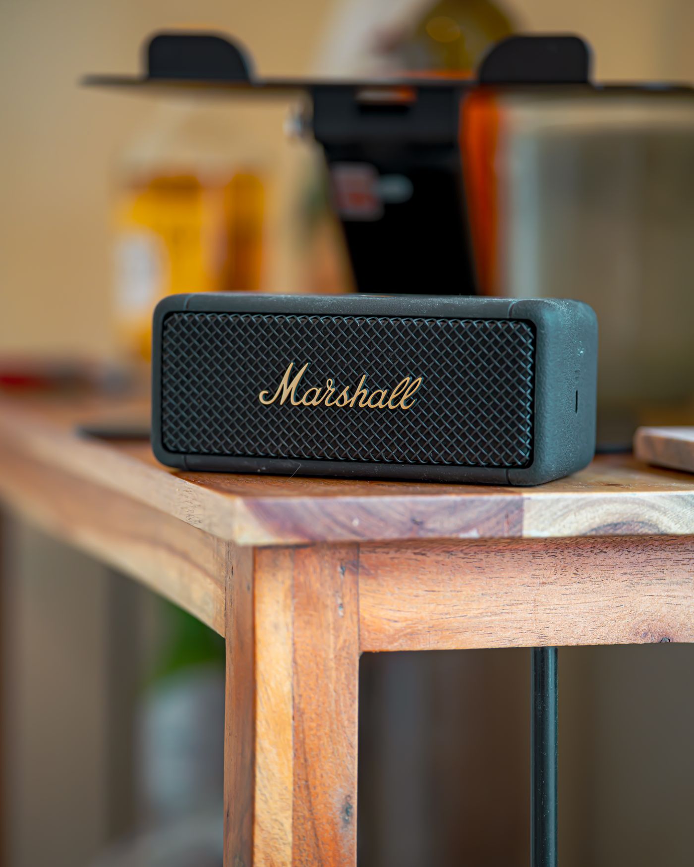 Portable Bluetooth speaker on a wooden table
