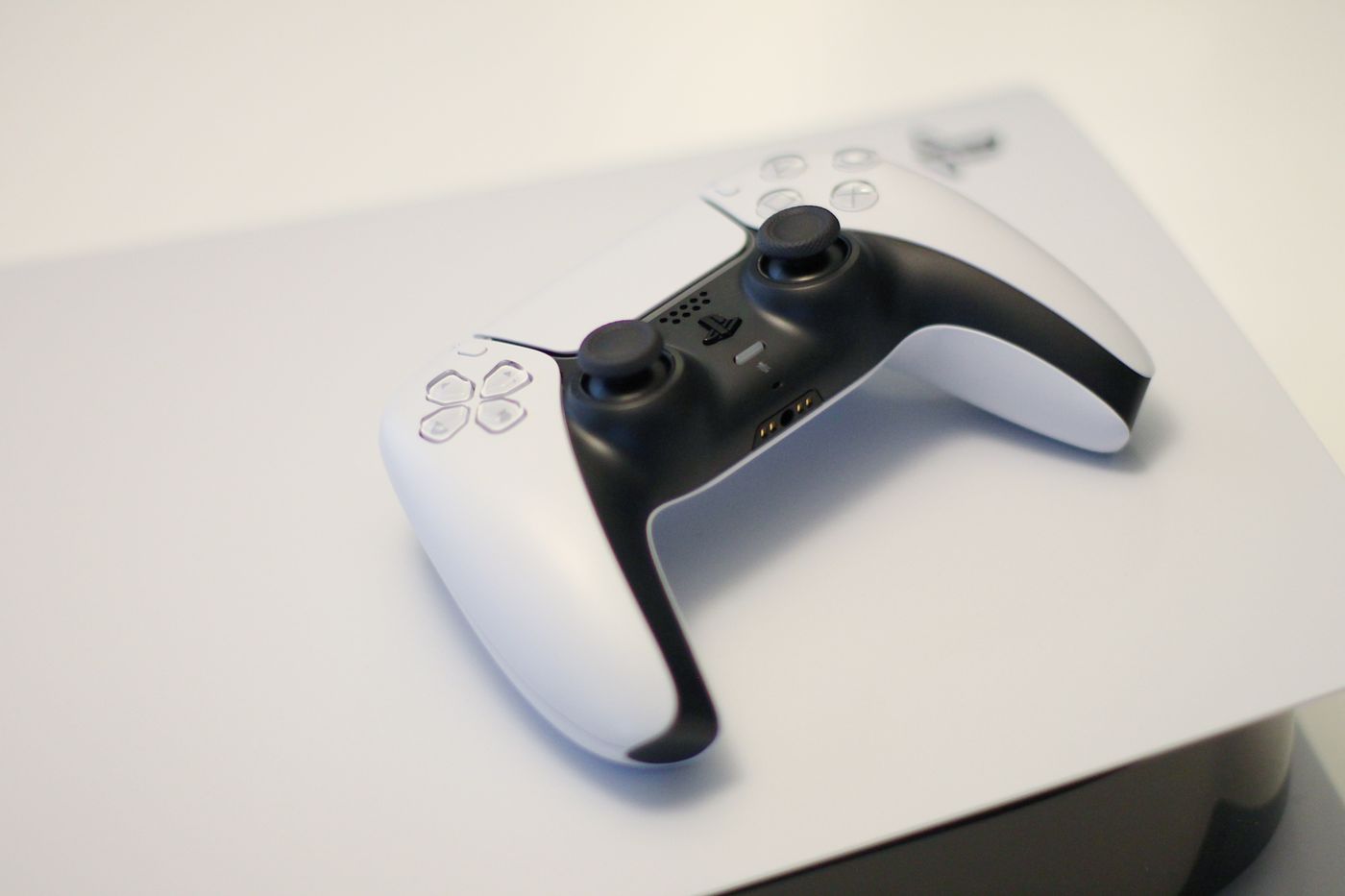 Game controller resting on a games console