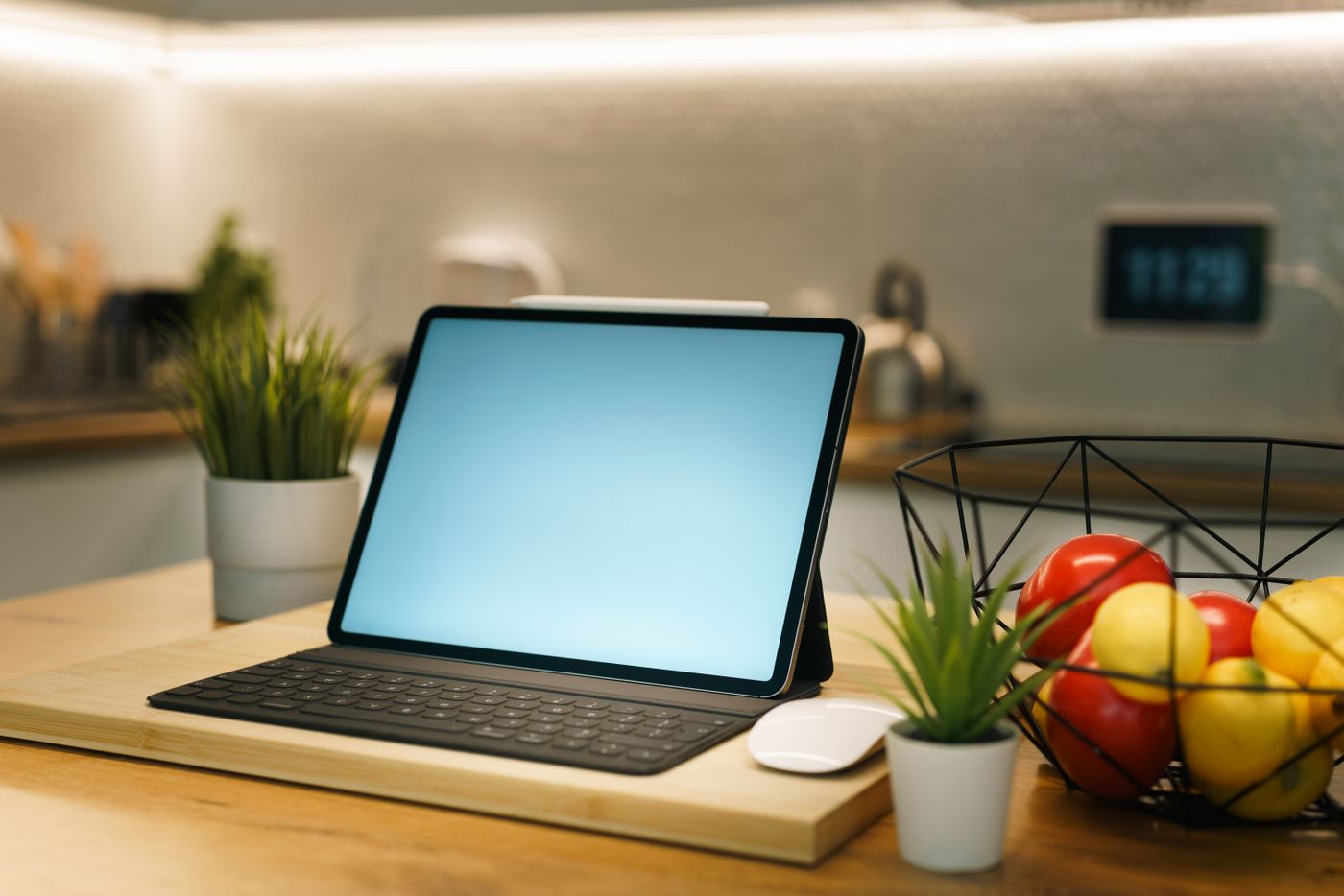 Tablet set up on a stand in a home kitchen