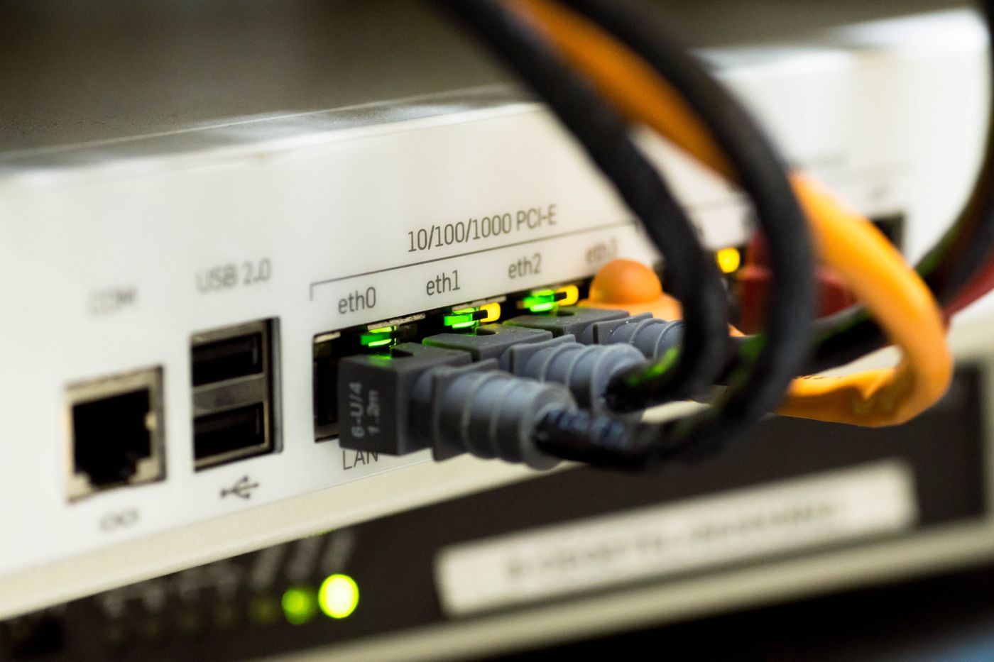 Network cables connected to labelled ports on a router