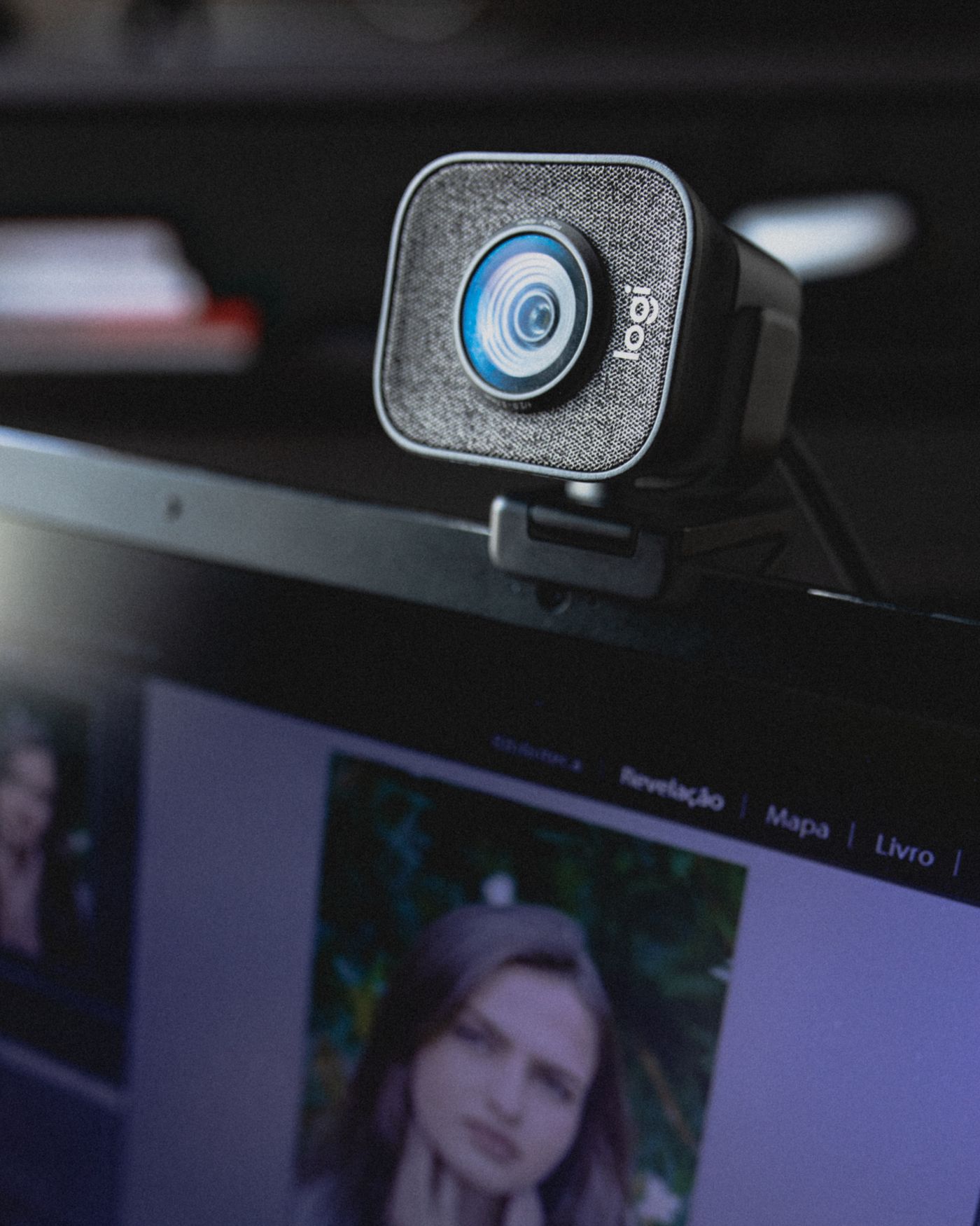 External webcam attached to the top of a laptop screen