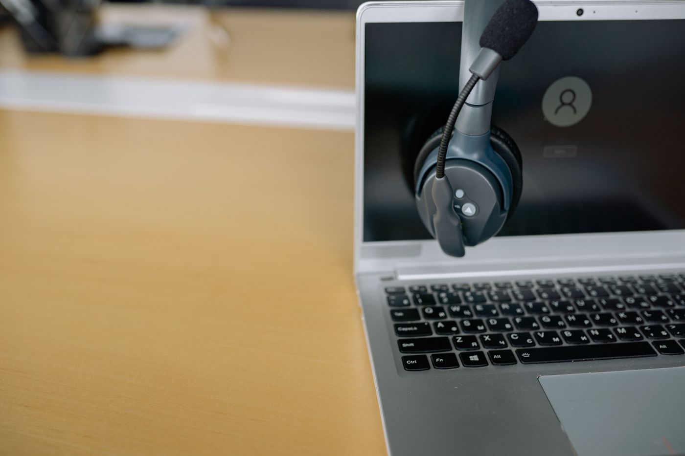 Headset resting on a laptop